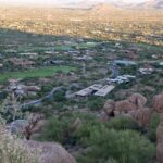 Aerial view of town in valley with mansions, roads, golf course in Fountain Hills, Arizona, USA.