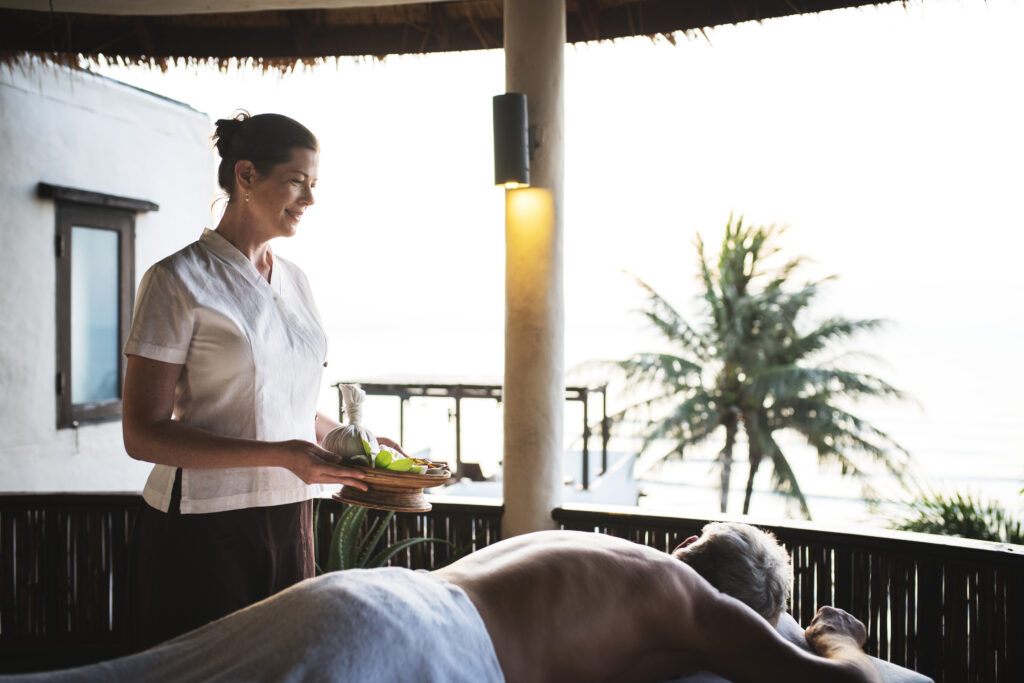 Massage therapist massaging at a spa